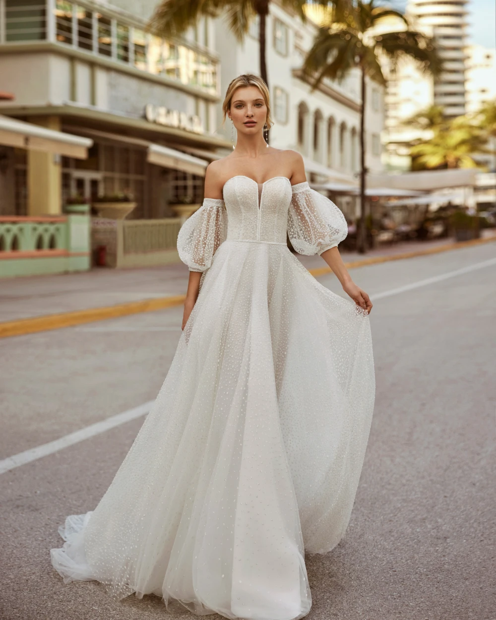 Model wearing Catalina by Luna Novias