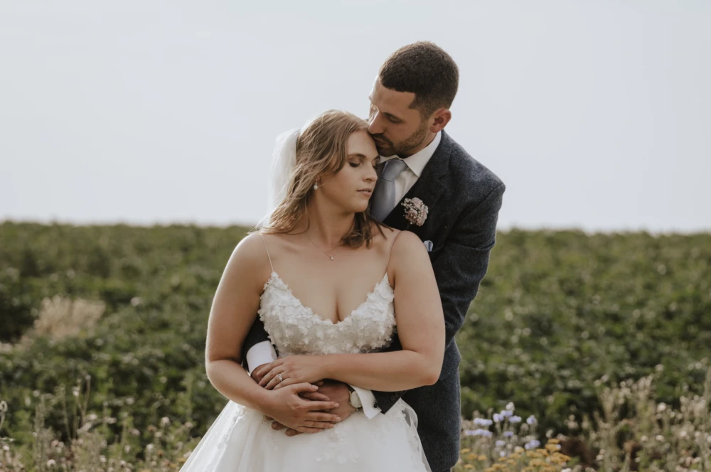 Bride and groom in a tender embrace