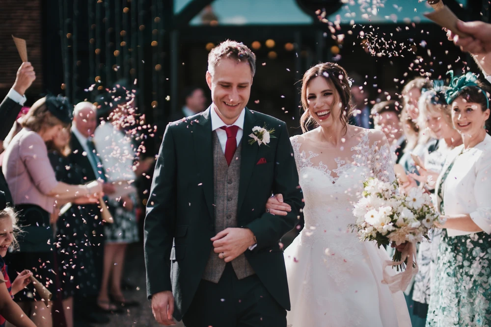 Confetti thrown onto bride and groom