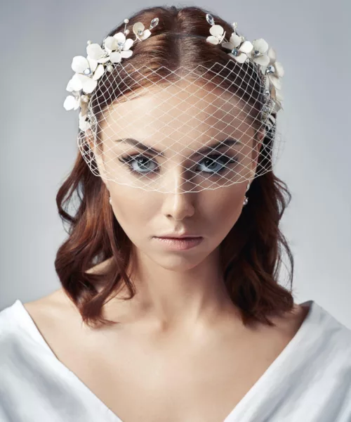 Model wearing a birdcage face veil.