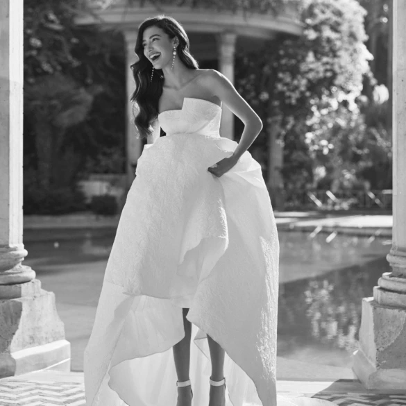 Model holding her dress off the floor