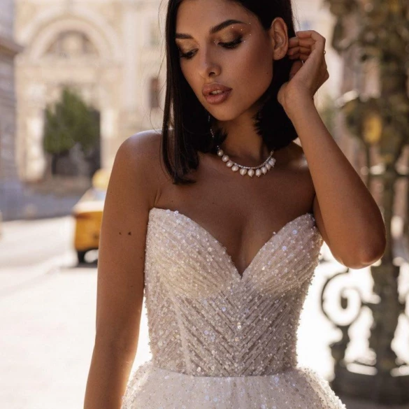 Model wearing wedding dress with sparkles on the corset