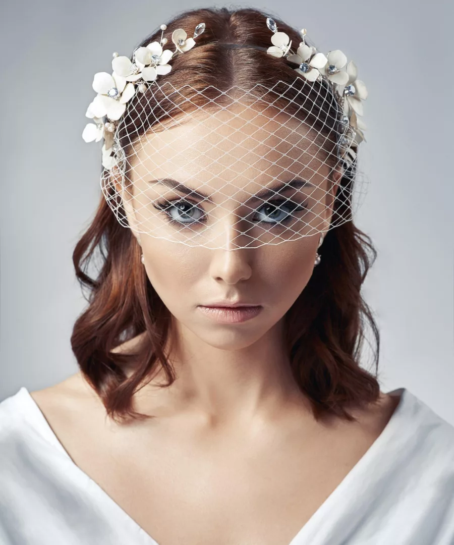 Model wearing a birdcage face veil.